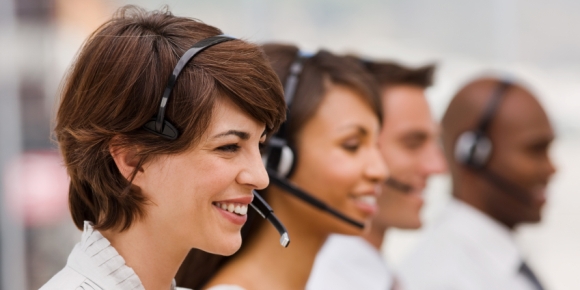 Happy call center employees with headset